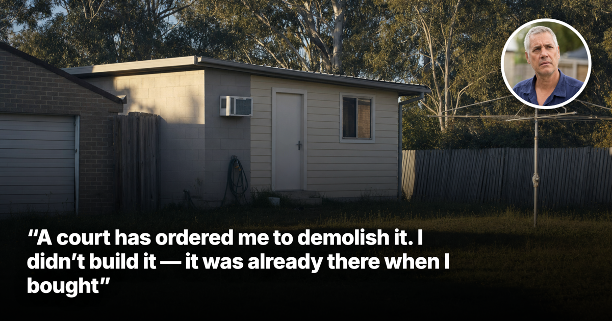 A small unapproved self-contained studio behind a garage in an Australian suburban back yard