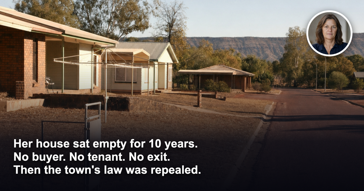 Empty street of vacant single-storey houses with dry lawns in an Australian outback mining town