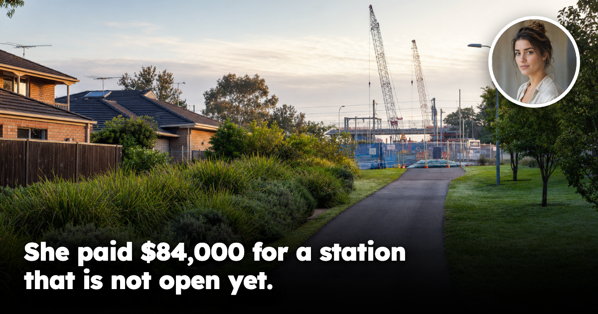 Empty Australian suburban footpath leading toward a distant rail construction zone