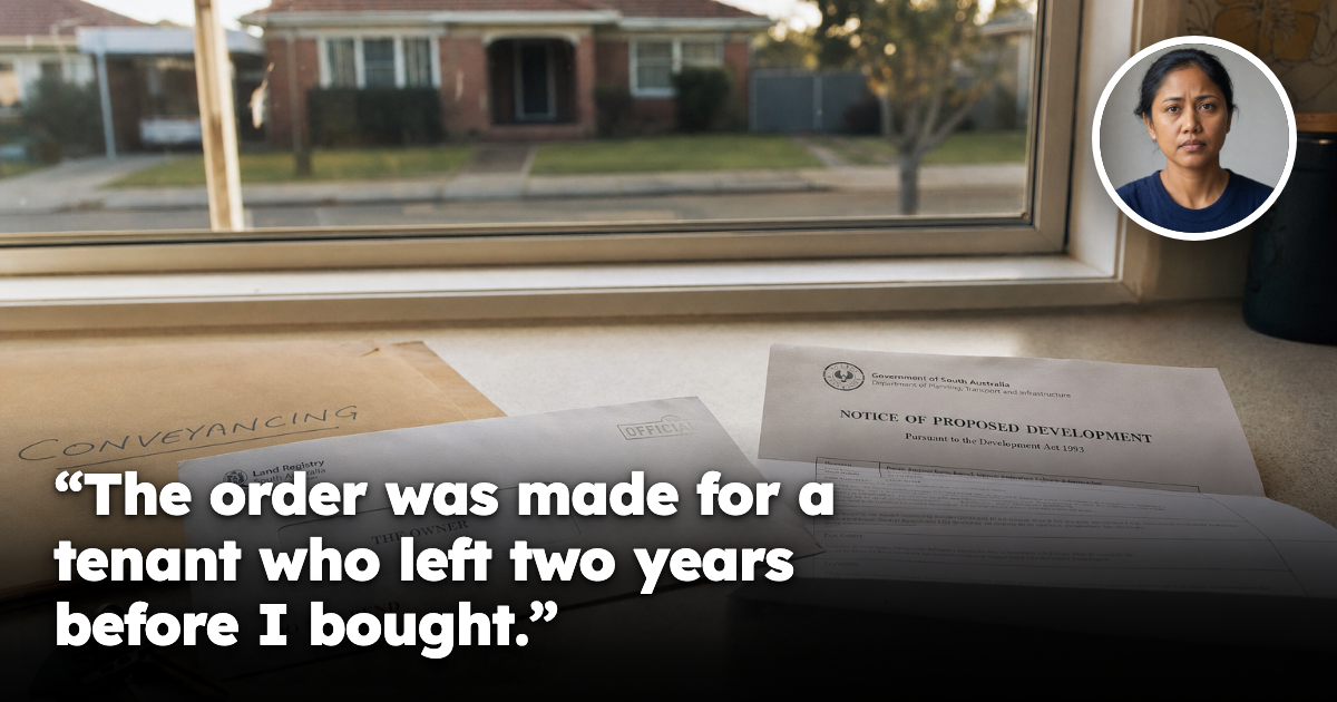 An official letter addressed to 'the owner' beside house keys and a conveyancing folder on a kitchen bench in an Australian brick home