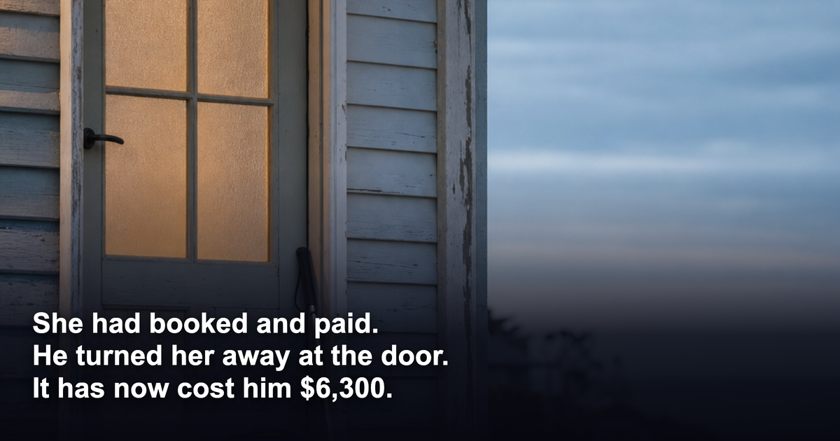 A closed front door of a weatherboard Australian coastal holiday house at dusk with a packed suitcase and a folded white mobility cane leaning beside it on the verandah